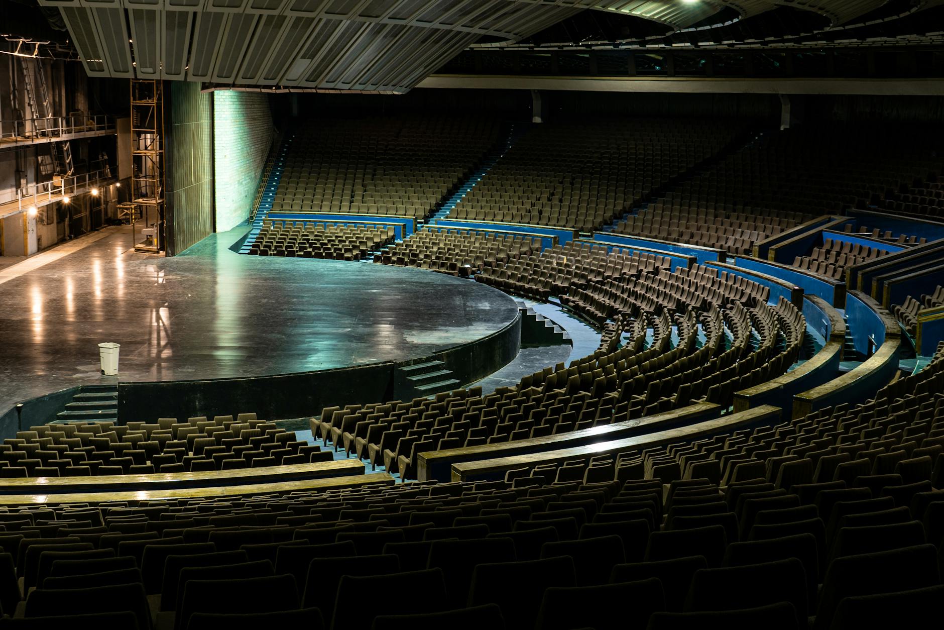 an empty theatre with lights turned on during nighttime